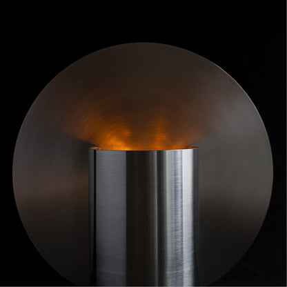 BeCandle x The Grey Green Vase Candle 400g lit, scented soy candle burning in stainless steel vessel with warm glow.
