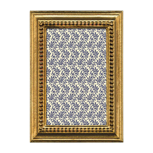 Decorative gold frame with a blue and white patterned interior on a white background