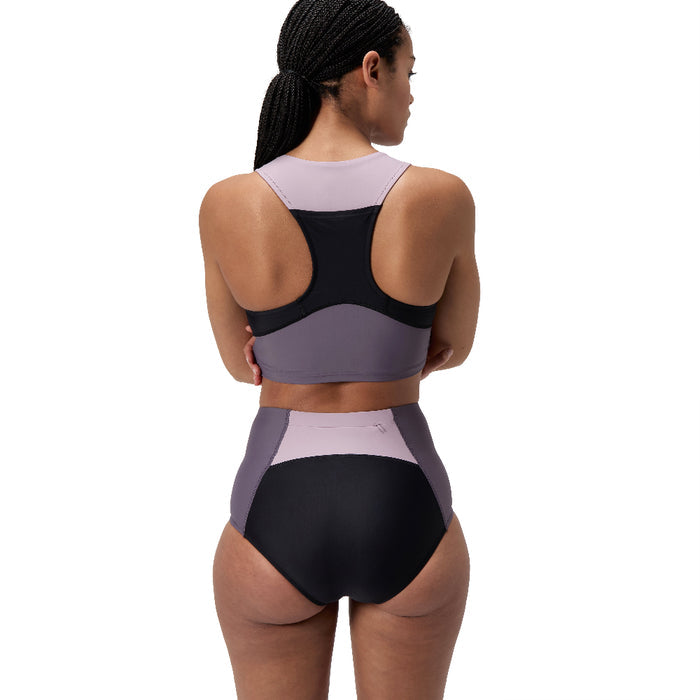 Woman in a Speedo Asia Fit Colorblock Boyleg swimsuit bottom and matching top, featuring black and muted purple panels.