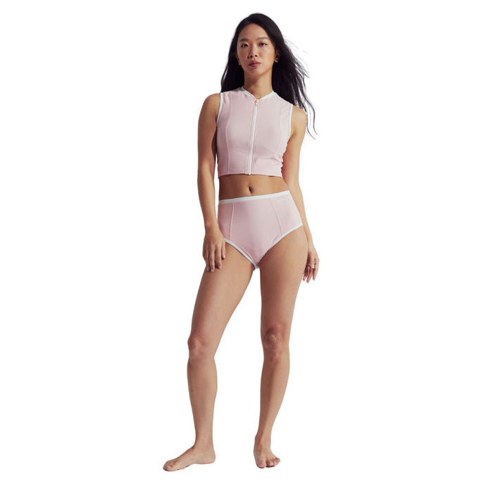 Woman wearing a pink Speedo Wavechasers 2.0 crop zip vest with white trim and a front zipper.